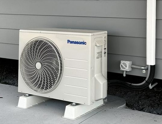 Panasonic aircon unit outside of house